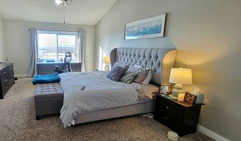King size bed with electric frame in high-ceiling room