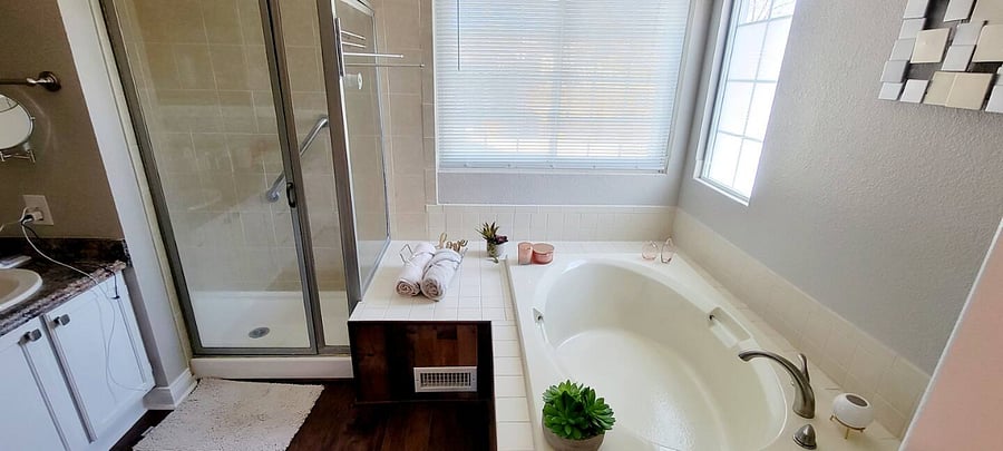 Private bathroom with shower and tub