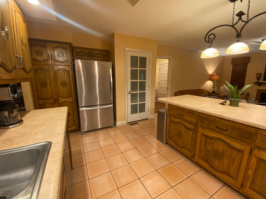 Wooden cabinets and full size pantry (the white frosted door) for plenty of storage!