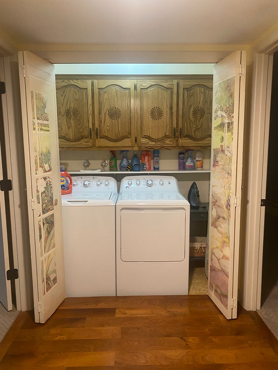 Laundry: full washer and dryer, iron and ironing board, lots of storage... light and ceiling vent, too