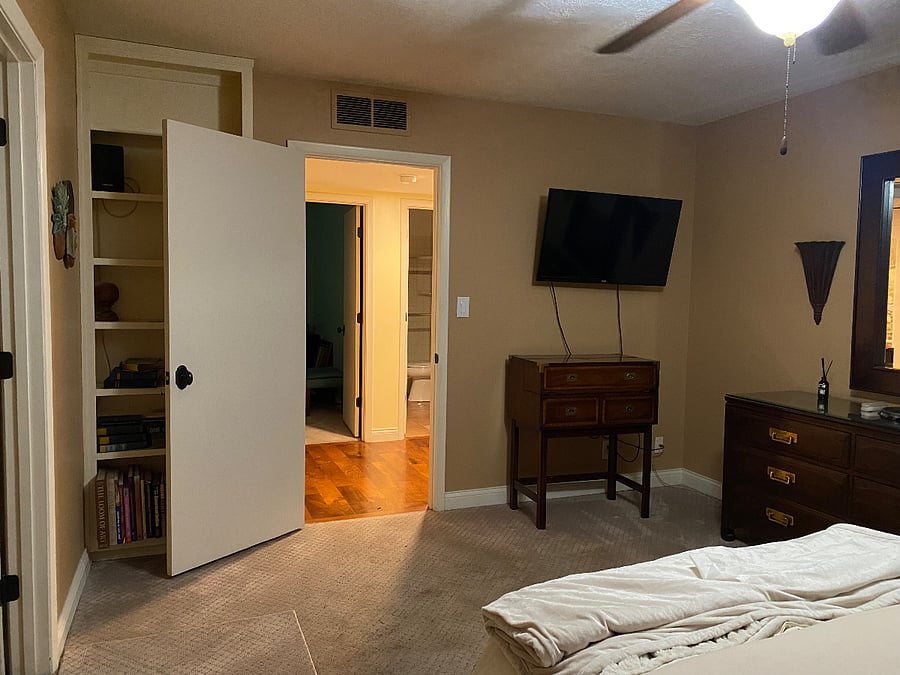 Master Bedroom has Smart TV Ceiling fan and built in bookshelves.