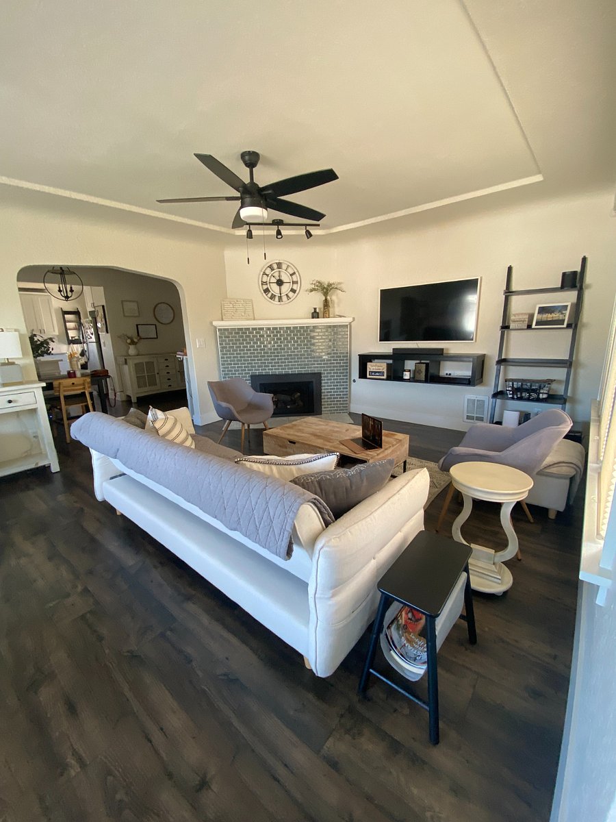 Living room with gas fireplace - best thing all winter! Plenty of seating around the smart TV