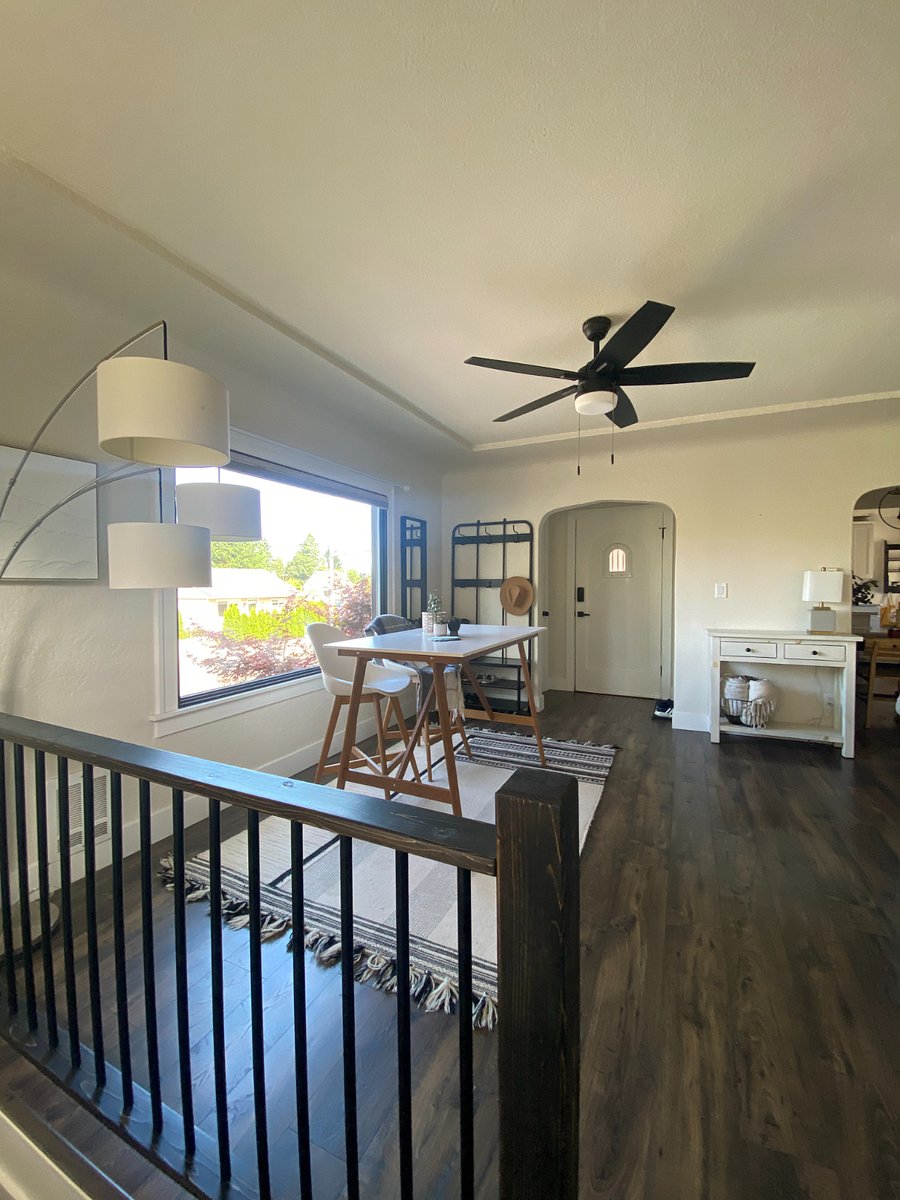 Looking at front door from stairs down to garage/laundry area 