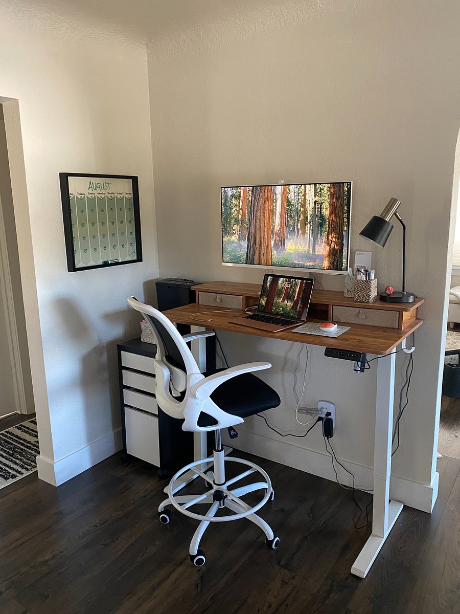 Sit-stand desk with some office equipment for work-from-home days