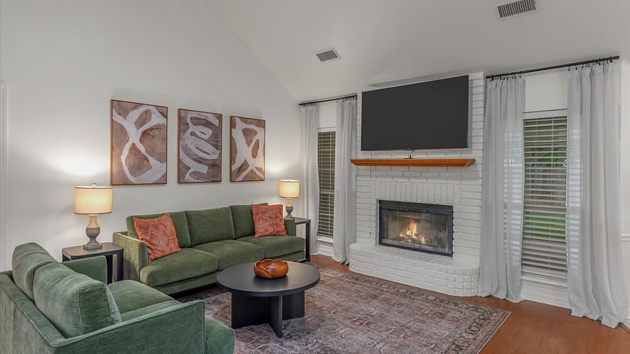 Living room with natural light, fireplace & Roku TV