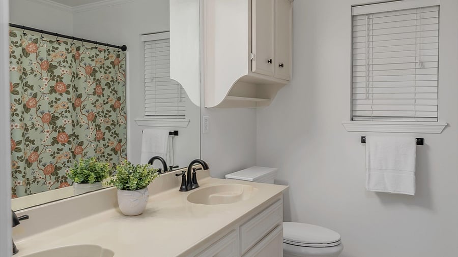 Guest Bathroom with double vanities, tub and shower