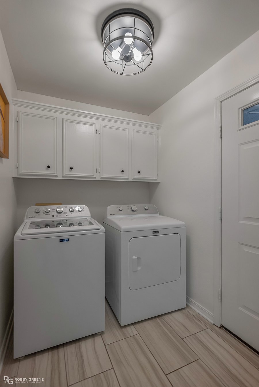 Enclosed laundry room near the kitchen & 2-car garage. Stocked with laundry detergent and dryer sheets.