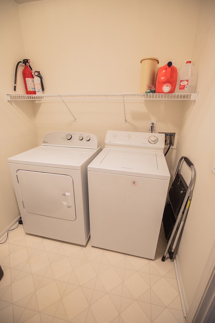 laundry room with iron and ironing board