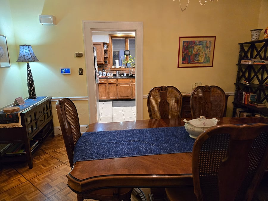 Formal dining room adjoins living room, kitchen and office/library.