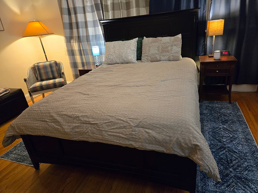 Master bedroom has queen bed, en-suite bath with shower, walk-in closet, dresser, workstation, shelves, reading corner, full-length mirror and blackout curtains. Room dimensions 16 ft 8" X 11Ft 6" (circa 190 sq feet)