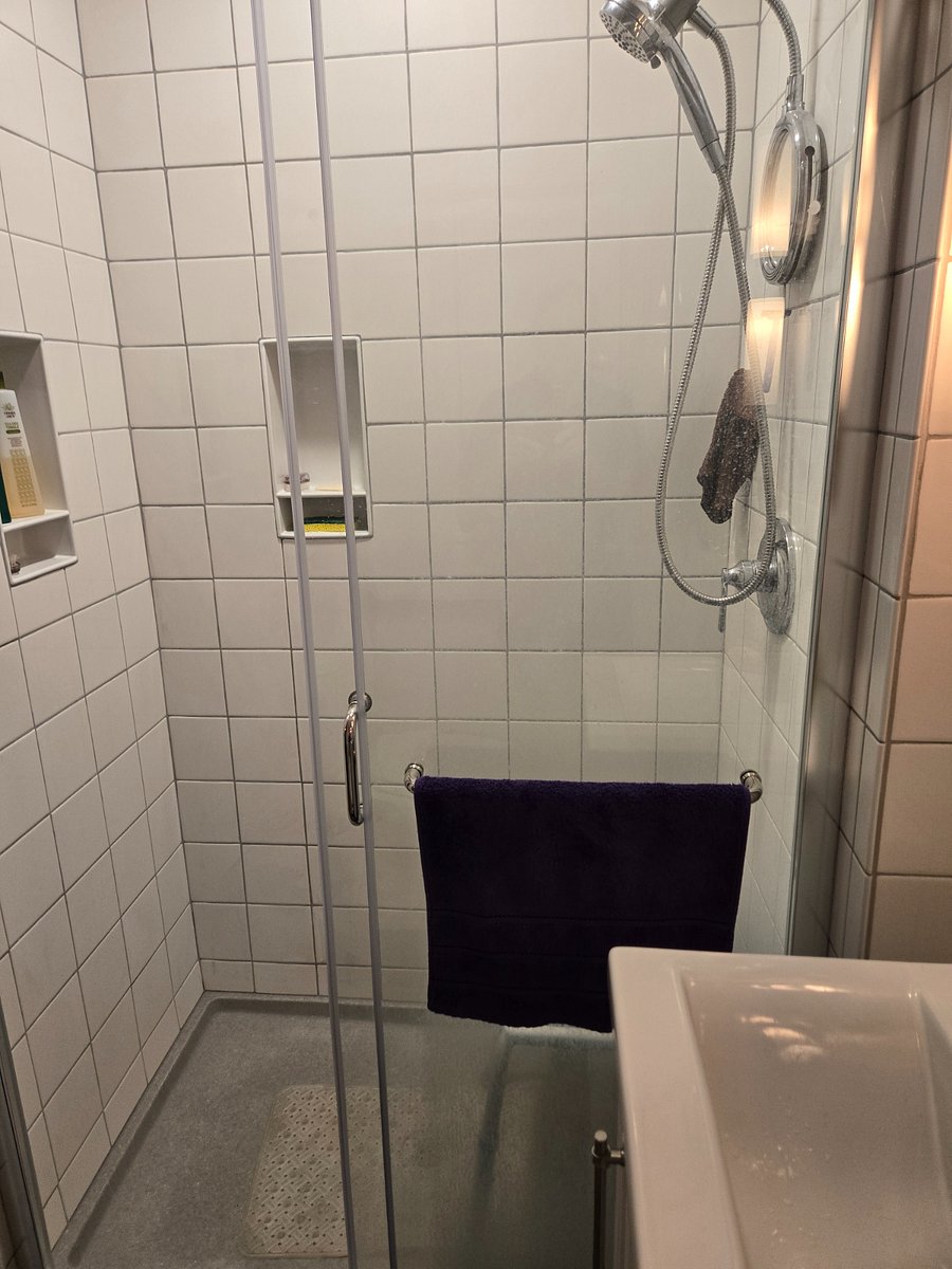 En-suite bath with shower attached to master bedroom.