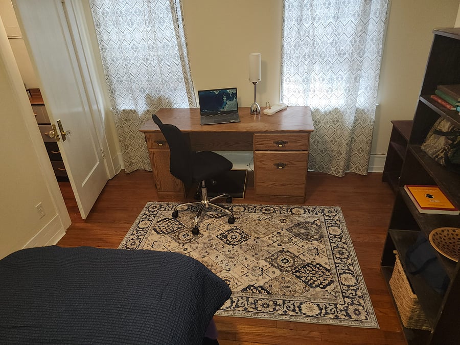 Twin room has twin bed, walk-in closet with dresser and hooks, room-darkening shades, workstation and shelves. Full bath is down the hall. Room dimensions: 13 ft 5 inches X 9 ft (circa 121 sq feet)