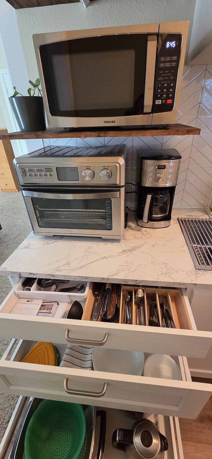 Kitchenette is fully stocked with dishes, flatware, utensils, and small appliances
