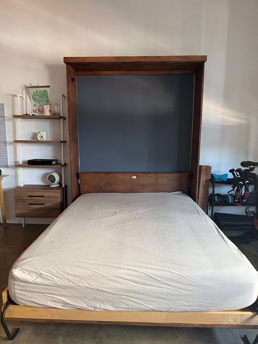 Queen size murphy bed for easy concealing, sheets and comforter will be provided