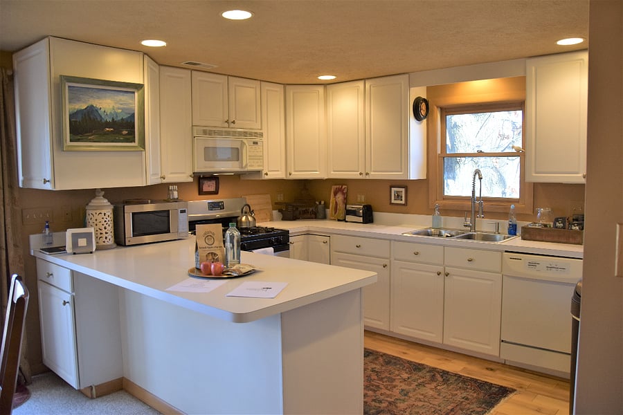 The full kitchen has everything you need for a relaxing stay, even a dishwasher