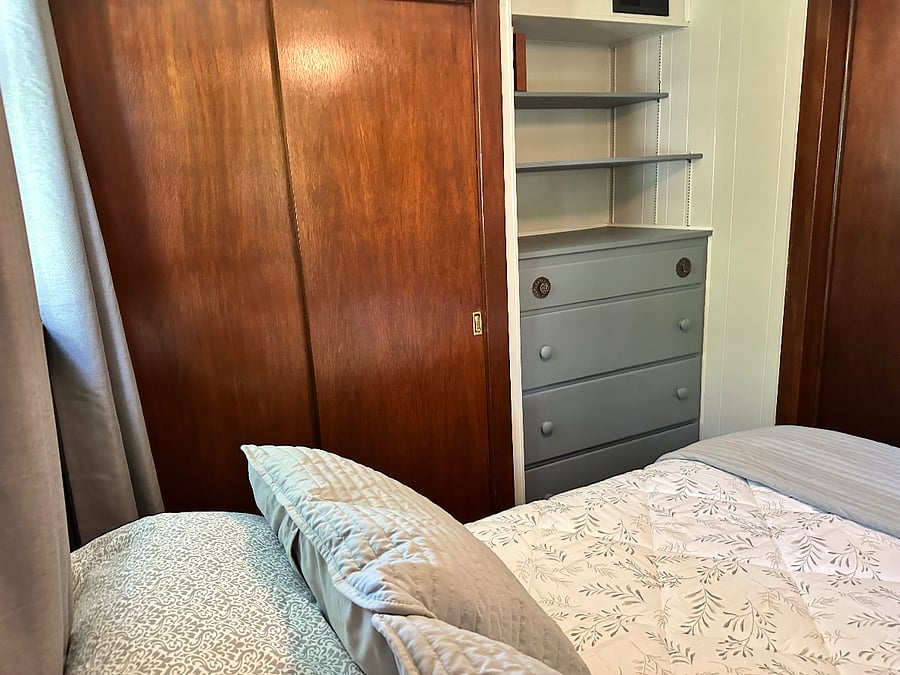 Full size bedroom with built-in cabnitey.