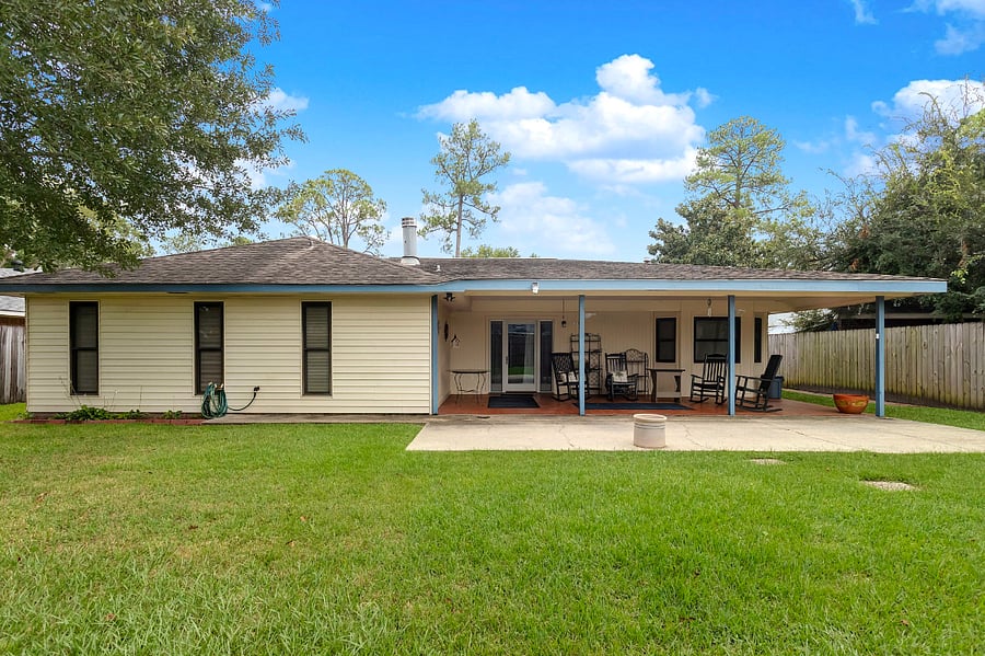 Covered back porch and fenced in yard