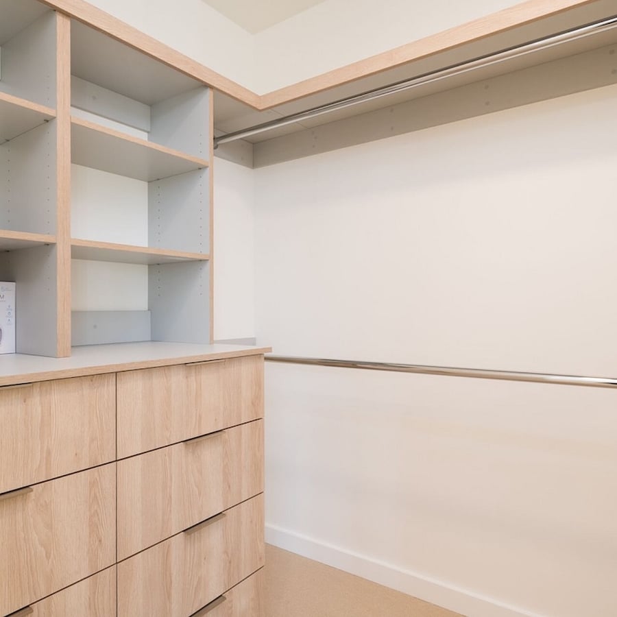 Primary bedroom walk-in closet