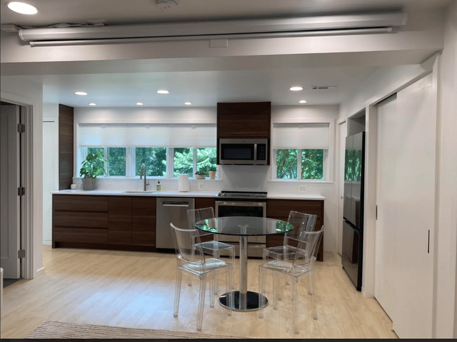 View of Kitchen and Dining Area from the Bedroom Area. Note 100 inch Automated Screen & Projector Near Ceiling.