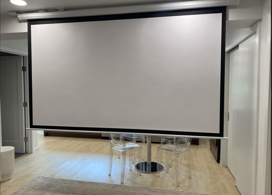 100 inch Automated Screen & Projector screen Extended and Set Up for Use with Your Streaming Services.