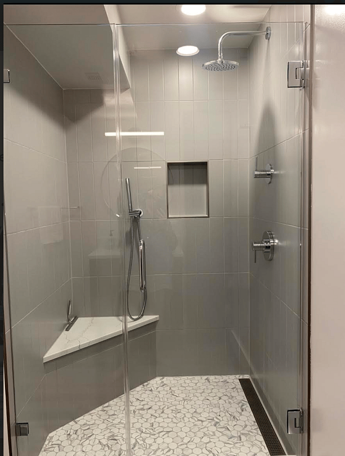 New Tiled Shower with Quartize Bench, Rain Head, and Wand