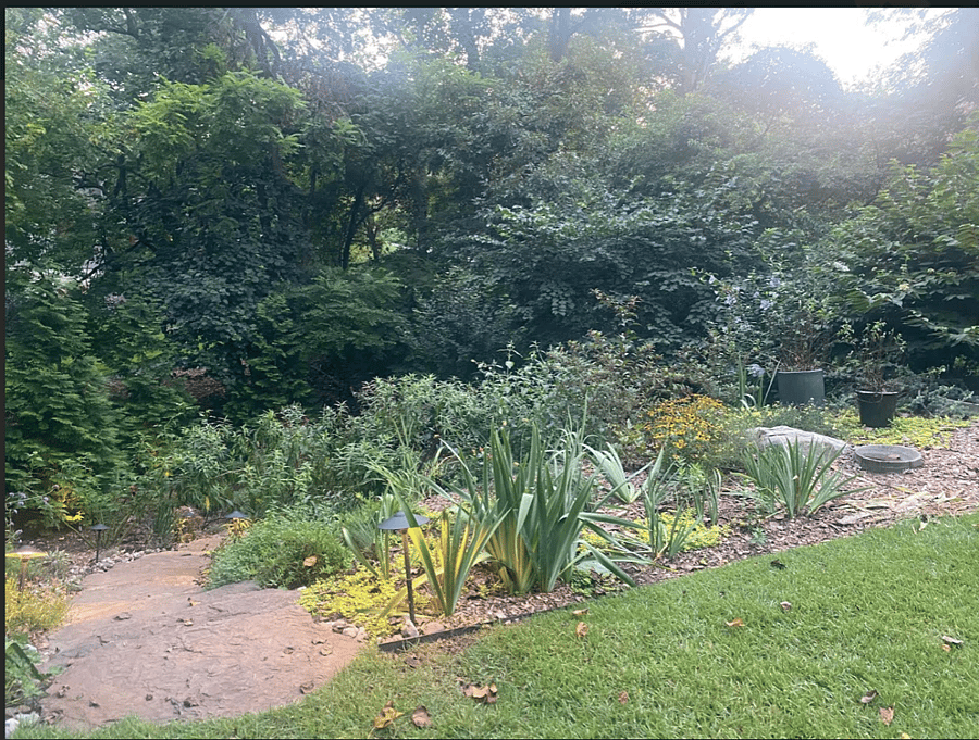 Garden Continues Down Custom Stone Steps Towards Gate to Private Community Pier.