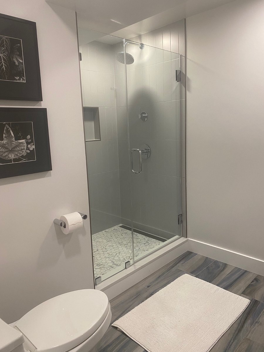 New Toilet and New Tiled Shower with Rain Head and Wand.