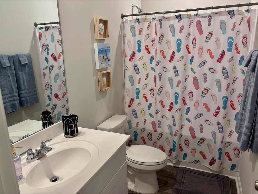 Full bath off the hallway on the first floor and opens directly into the 2nd Bedroom