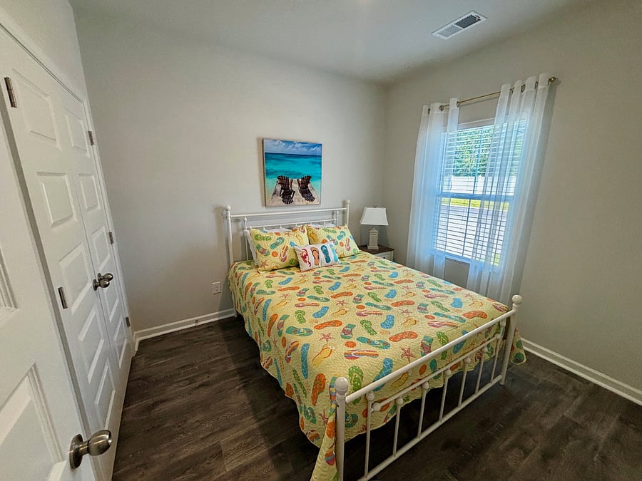 Second bedroom with queen bed. On the first floor. Direct access to the full bath that also opens into the hallway.