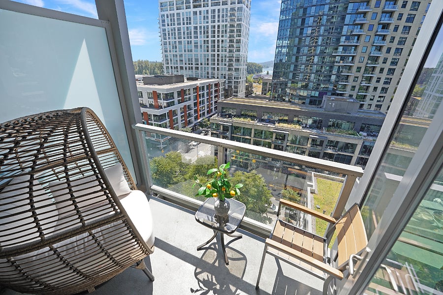 Private Balcony Outdoor seating with cityscape views.