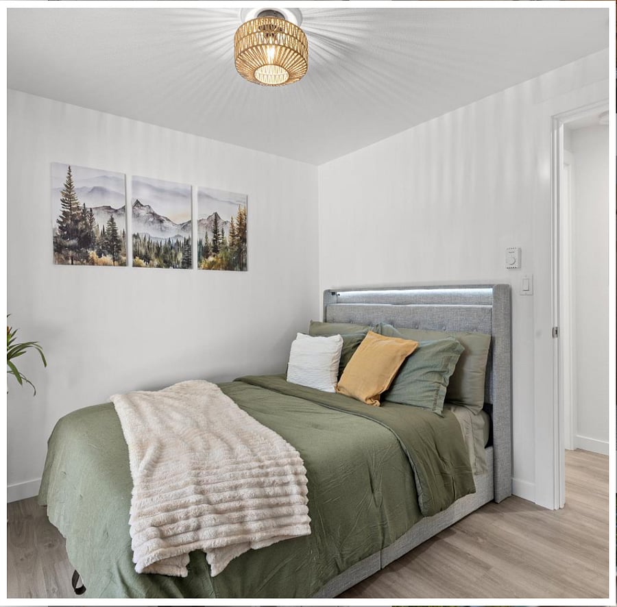 Second bedroom with a full lift-up bed for extra storage, built-in charging station, LED lights, and a stylish upholstered wingback frame.