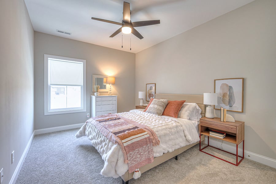 Secondary bedroom upstairs with a queen bed