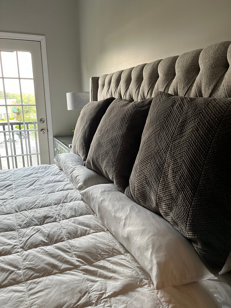 King bed features Restoration Hardware bedding and premium pillow-top mattress!
