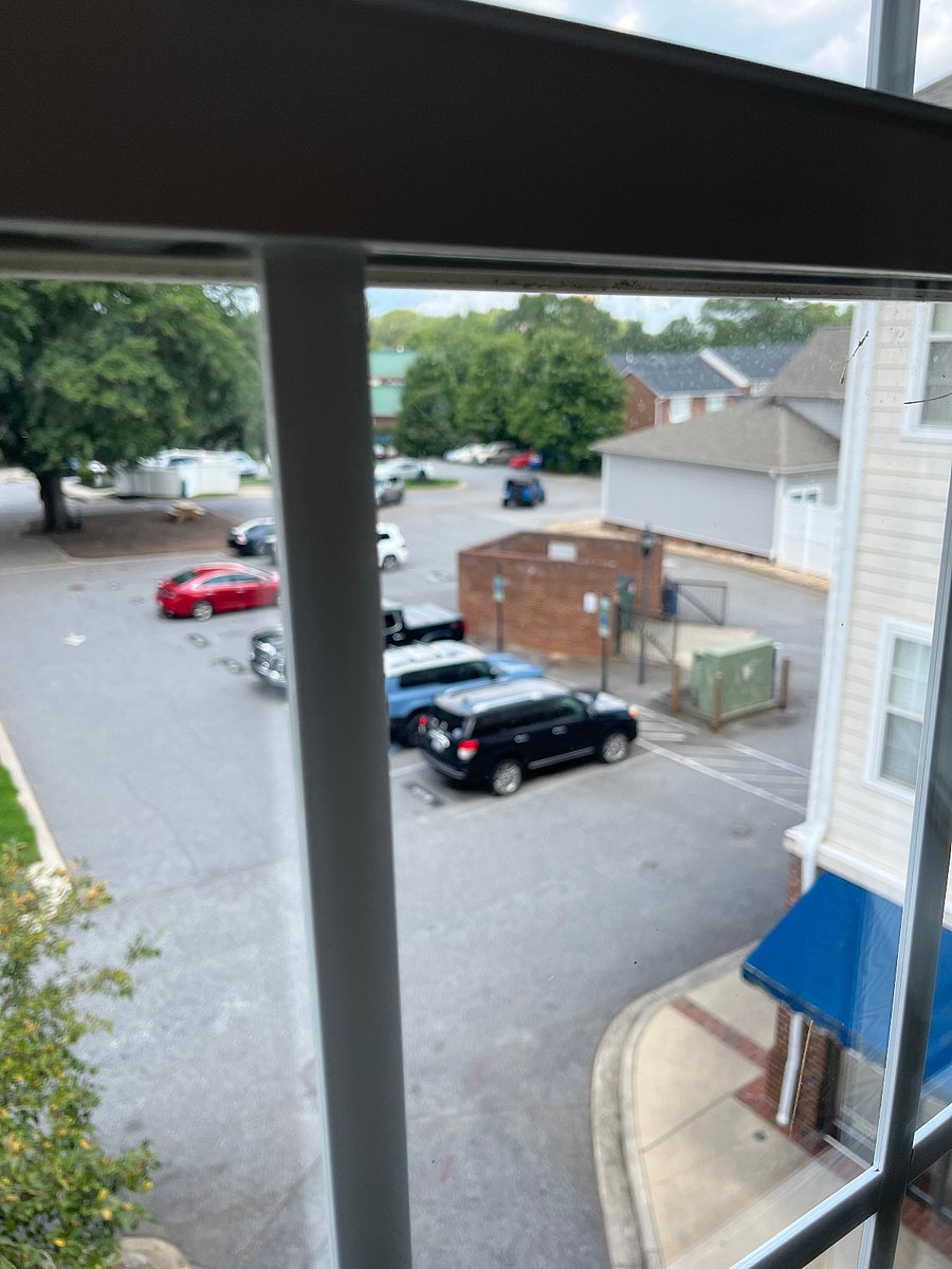 Lobby view of private parking lot with FREE designated parking space.