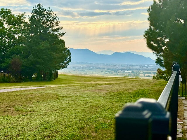 View from inside the fence by the gate zoomed in on the mountains.