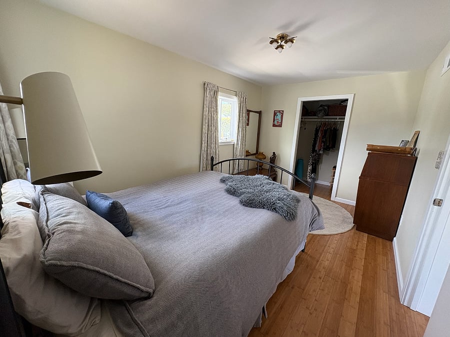 Smaller bedroom with closet. Includes blackout curtains.