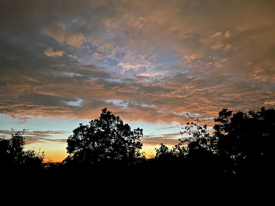 A view of a summer sunset from the Dining Room window.