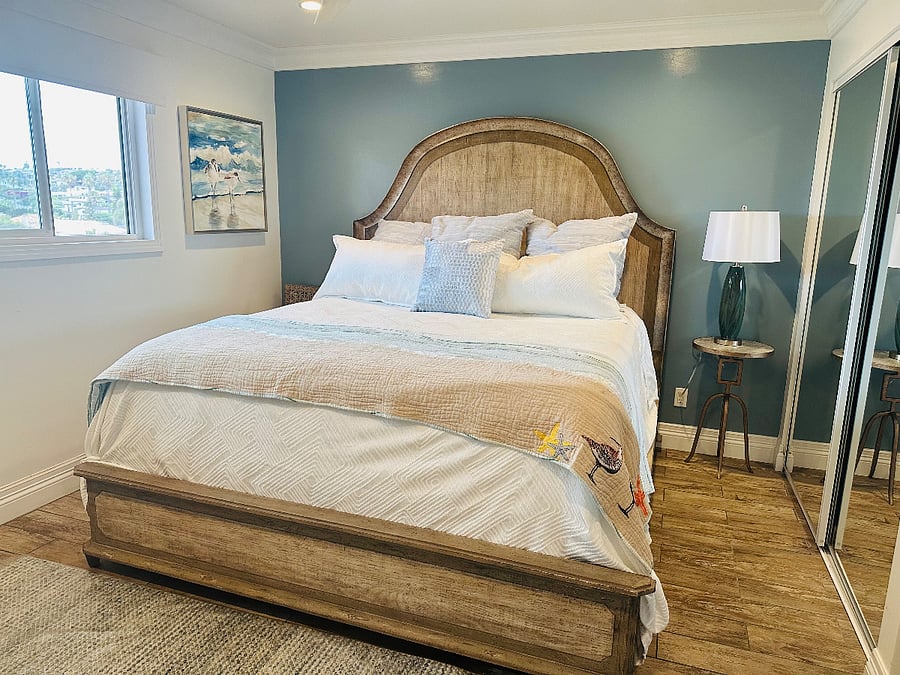 Guest bedroom features a King bed, views to Seaworld and their seasonal fireworks show.