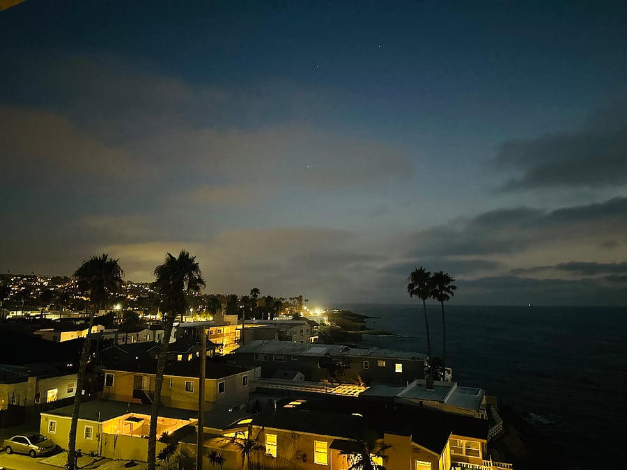 The view looking back at the lit up hills is reminiscent of a European seaside village!