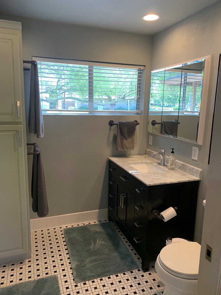 Bathroom with lots of storage. Toilet also has a bidet feature attached to it.