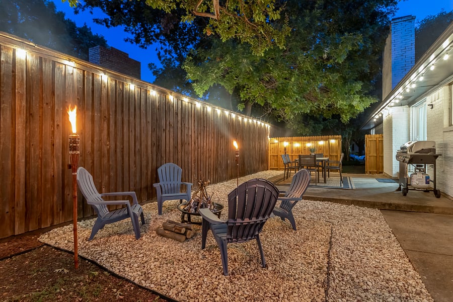 Outdoor fire pit and patio area with grill