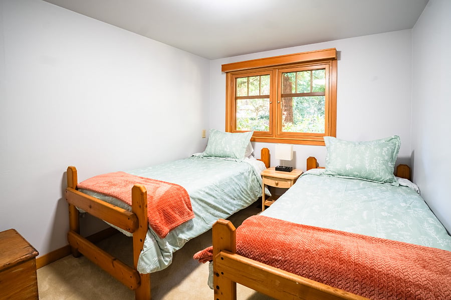 Two twin beds in room 3 with children's items