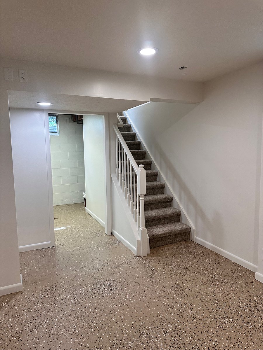 Basement storage room, stairs leading upstairs to kitchen