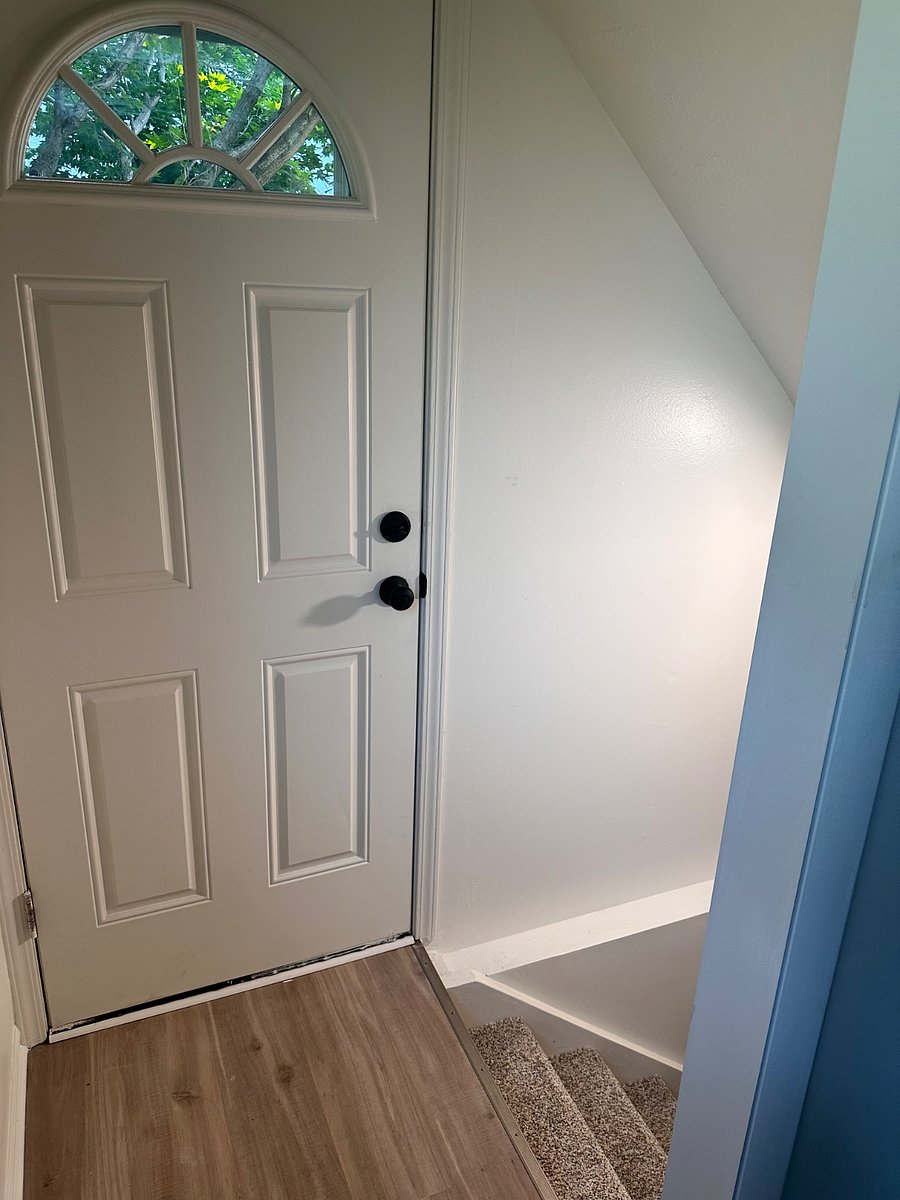 Door from kitchen to patio and backyard