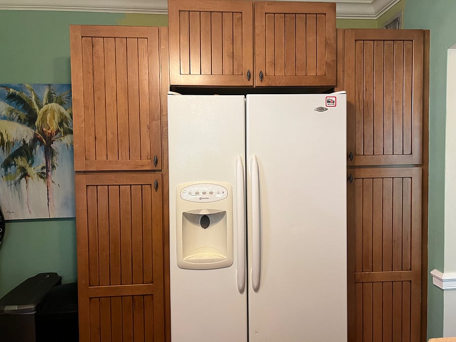 Full sized fridge in kitchen