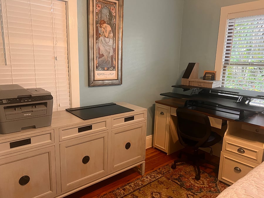 Working area in second bedroom with full sized bed