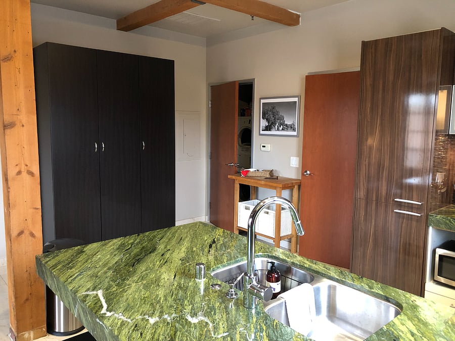 In this picture you can see the IKEA wardrobe, laundry room, door to bathroom and built-in refrigerator