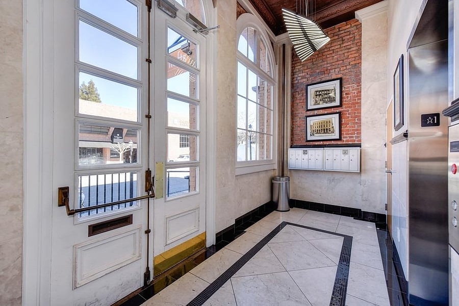 This is the secure lobby with locked mailboxes, elevator and staircase access. 