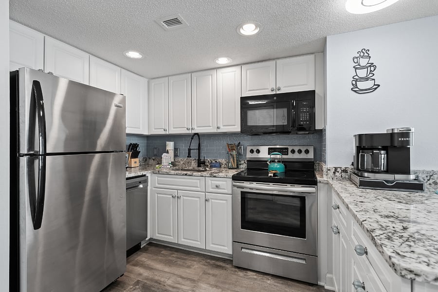 Updated appliances and fully stocked kitchen