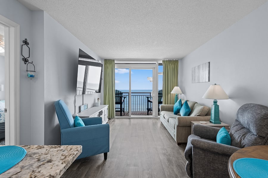 Living room with balcony and cozy seating